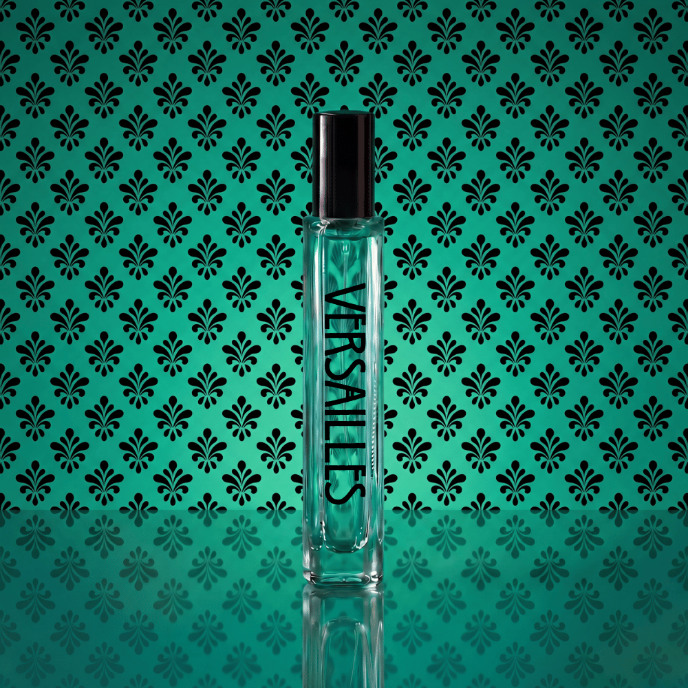 A clear glass Versaces perfume bottle with a black cap, standing upright against a teal background with a repeating black damask pattern.